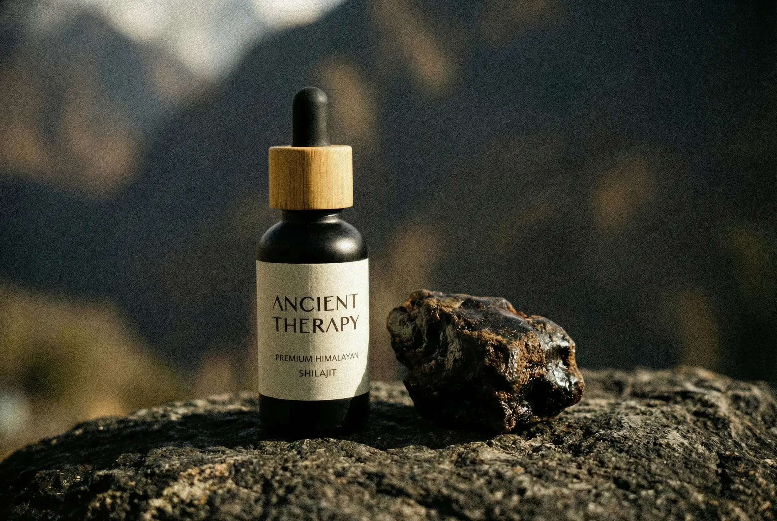 Shilajit mineral resin drops on raw stone with natural Himalayan material