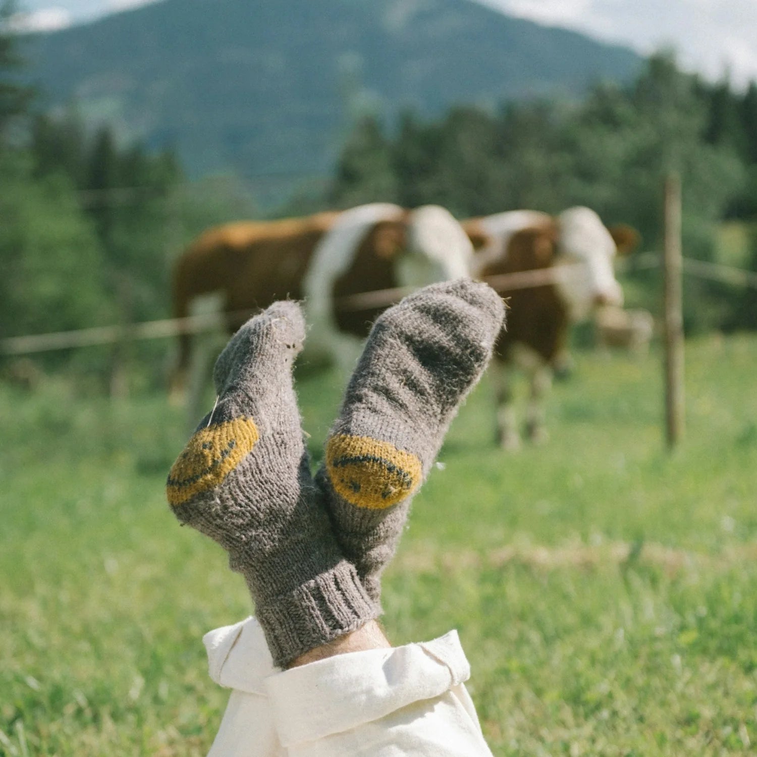 Person relaxing outdoors in wool socks, symbolizing calm and stress relief