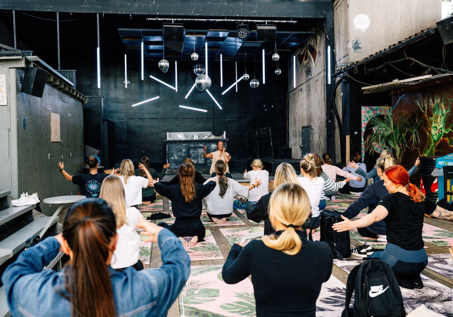 Group of people in yoga class sponsored by ancient therapy